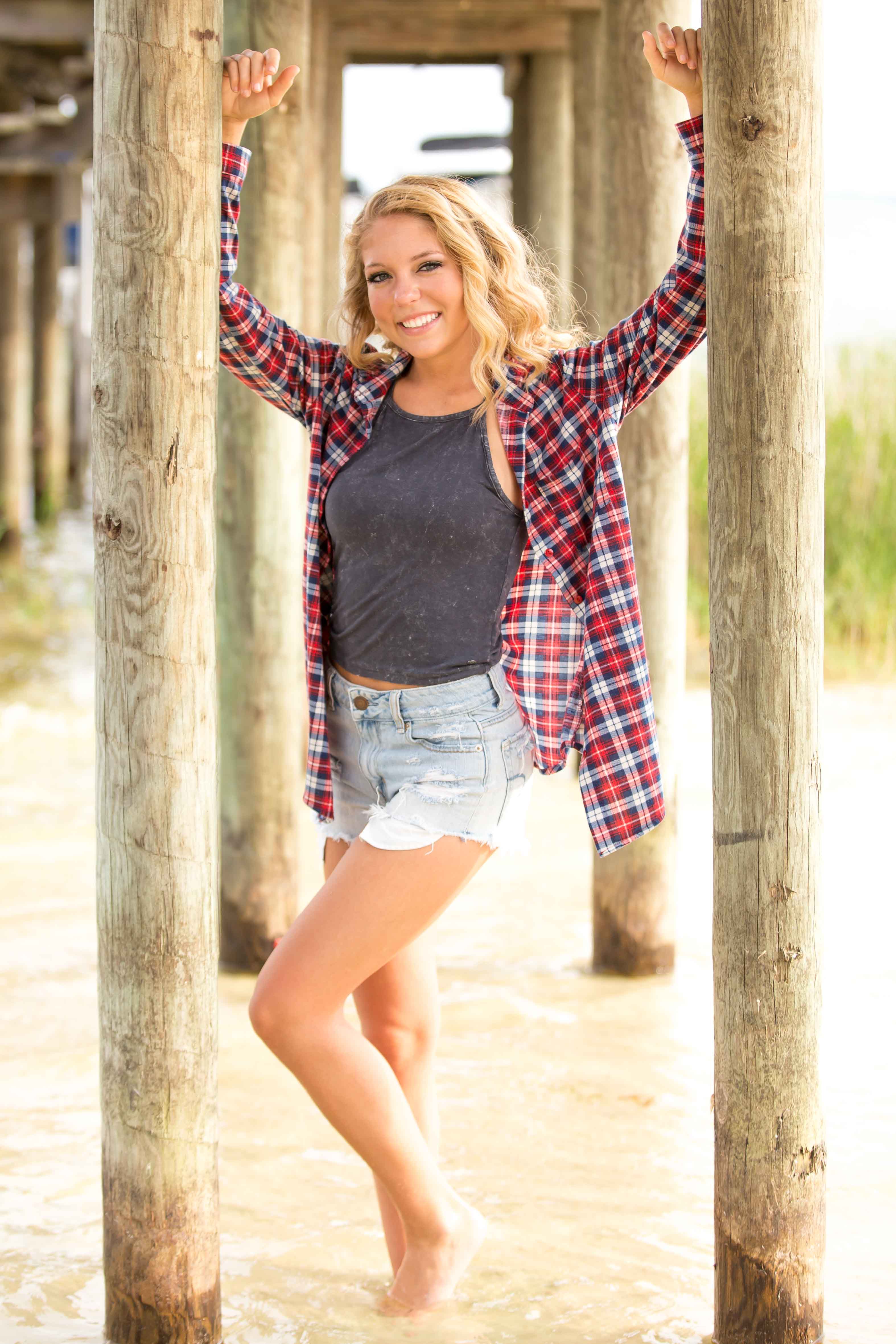 high school senior posed at lake weir in ocala